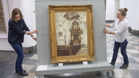 Two woman carrying a painting two woman carrying a big painting