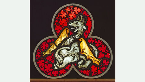 Stained glass with dragons on a red background